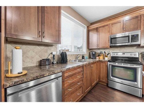 1118 New Brighton Park Se, Calgary, AB - Indoor Photo Showing Kitchen With Stainless Steel Kitchen With Double Sink