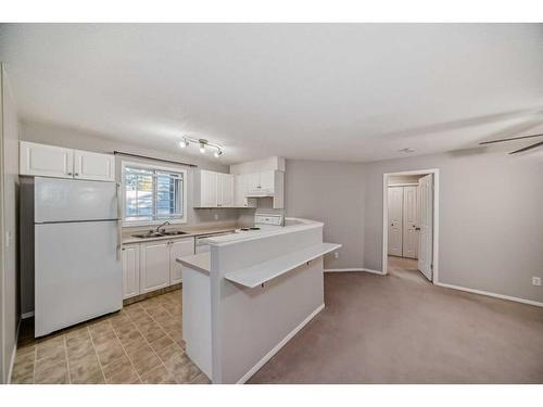 2115-2280 68 Street Ne, Calgary, AB - Indoor Photo Showing Kitchen With Double Sink