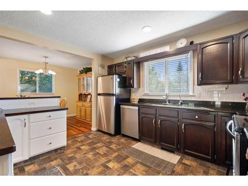 216 Ranch Estates Place Nw, Calgary, AB - Indoor Photo Showing Kitchen With Stainless Steel Kitchen With Double Sink