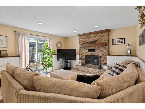 216 Ranch Estates Place Nw, Calgary, AB - Indoor Photo Showing Living Room With Fireplace