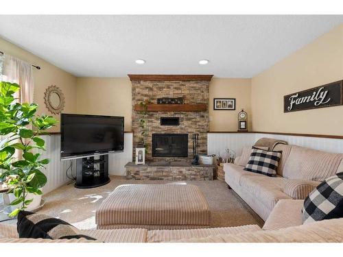 216 Ranch Estates Place Nw, Calgary, AB - Indoor Photo Showing Living Room With Fireplace