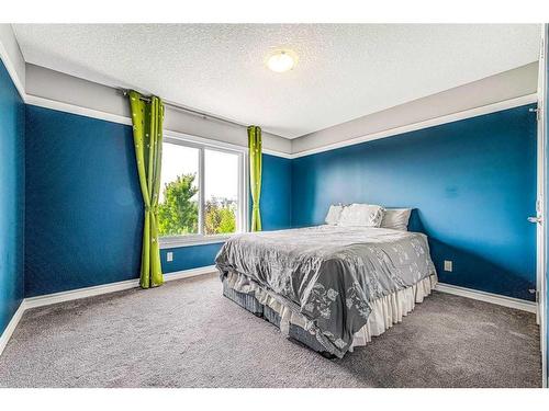 6 Cranbrook Hill Se, Calgary, AB - Indoor Photo Showing Bedroom