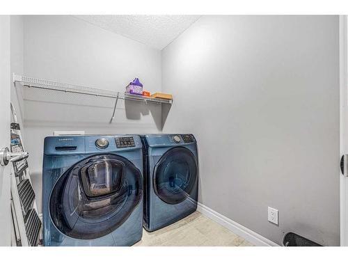 6 Cranbrook Hill Se, Calgary, AB - Indoor Photo Showing Laundry Room