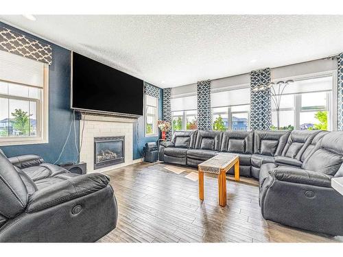 6 Cranbrook Hill Se, Calgary, AB - Indoor Photo Showing Living Room With Fireplace