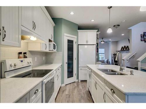 154 Autumn Crescent Se, Calgary, AB - Indoor Photo Showing Kitchen With Double Sink With Upgraded Kitchen