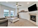 154 Autumn Crescent Se, Calgary, AB  - Indoor Photo Showing Living Room With Fireplace 