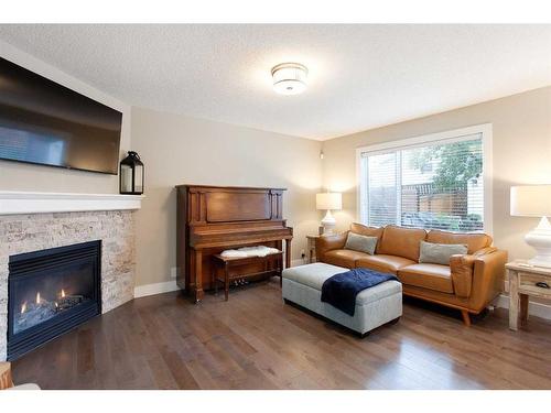 1043 Bridlemeadows Manor Sw, Calgary, AB - Indoor Photo Showing Living Room With Fireplace