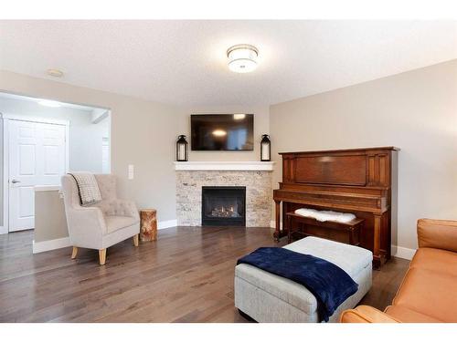 1043 Bridlemeadows Manor Sw, Calgary, AB - Indoor With Fireplace