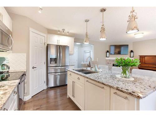 1043 Bridlemeadows Manor Sw, Calgary, AB - Indoor Photo Showing Kitchen With Double Sink With Upgraded Kitchen