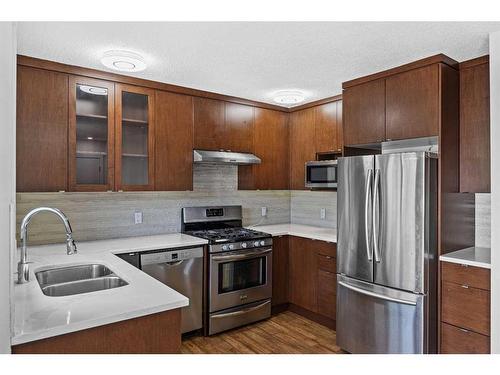 82 Taraglen Road Ne, Calgary, AB - Indoor Photo Showing Kitchen With Stainless Steel Kitchen With Double Sink With Upgraded Kitchen