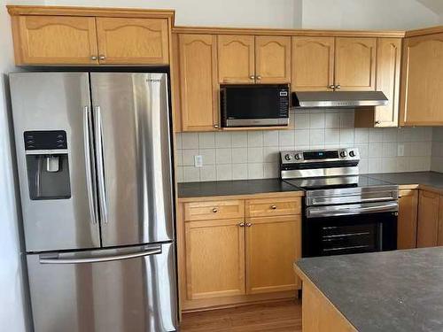 407-128 Centre Avenue, Cochrane, AB - Indoor Photo Showing Kitchen