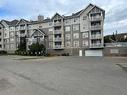 407-128 Centre Avenue, Cochrane, AB  - Outdoor With Balcony With Facade 