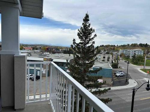 407-128 Centre Avenue, Cochrane, AB - Outdoor With Balcony With View