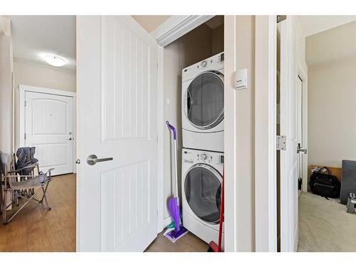 1416-130 Panatella Street Nw, Calgary, AB - Indoor Photo Showing Laundry Room