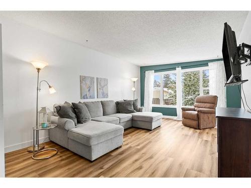 64 Pennsburg Way Se, Calgary, AB - Indoor Photo Showing Living Room