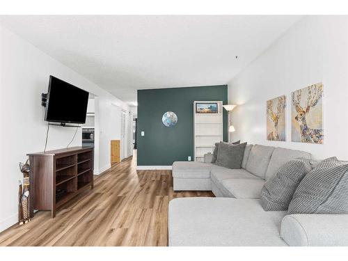 64 Pennsburg Way Se, Calgary, AB - Indoor Photo Showing Living Room