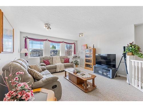 116 Oakmere Place, Chestermere, AB - Indoor Photo Showing Living Room