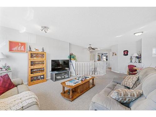 116 Oakmere Place, Chestermere, AB - Indoor Photo Showing Living Room