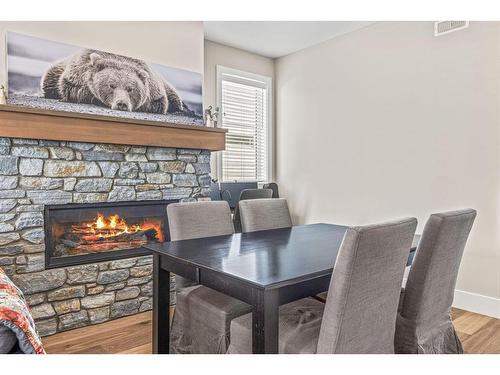 201G-1101 Three Sisters Parkway, Canmore, AB - Indoor With Fireplace