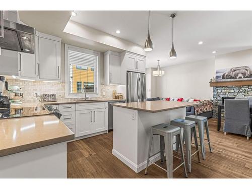 201G-1101 Three Sisters Parkway, Canmore, AB - Indoor Photo Showing Kitchen With Stainless Steel Kitchen With Upgraded Kitchen