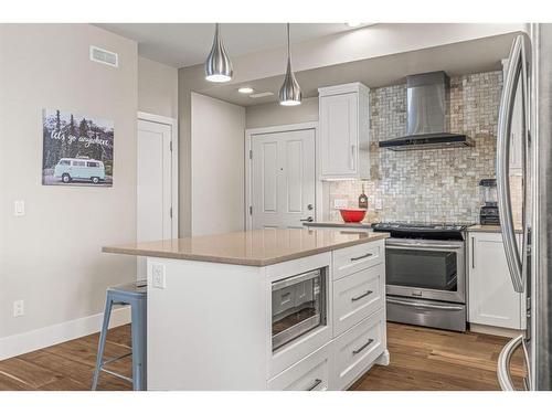 201G-1101 Three Sisters Parkway, Canmore, AB - Indoor Photo Showing Kitchen With Stainless Steel Kitchen With Upgraded Kitchen