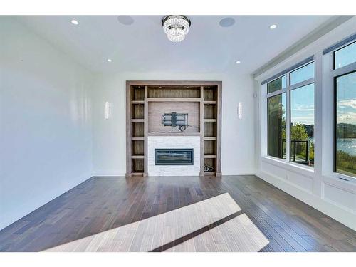 128 Kinniburgh Loop, Chestermere, AB - Indoor Photo Showing Living Room With Fireplace