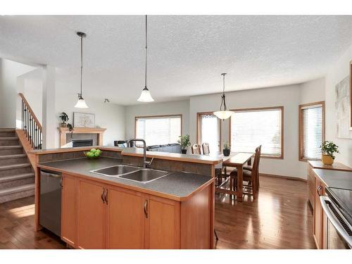 126 West Pointe Court, Cochrane, AB - Indoor Photo Showing Kitchen With Double Sink