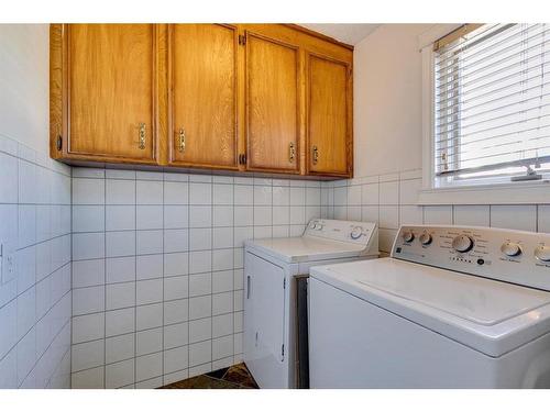 56 Millbank Close Sw, Calgary, AB - Indoor Photo Showing Laundry Room