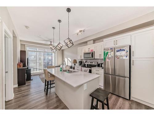 305-25 Walgrove Walk Se, Calgary, AB - Indoor Photo Showing Kitchen With Double Sink With Upgraded Kitchen