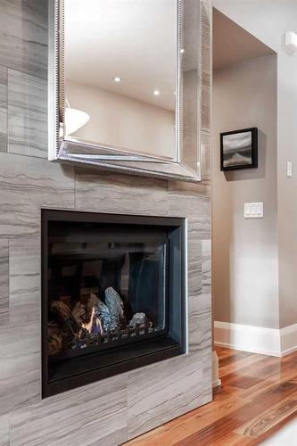 1-1934 36 Street Sw, Calgary, AB - Indoor Photo Showing Living Room With Fireplace