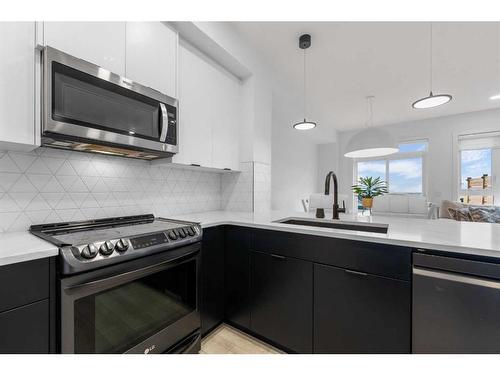 215 Creekstone Way Sw, Calgary, AB - Indoor Photo Showing Kitchen With Upgraded Kitchen