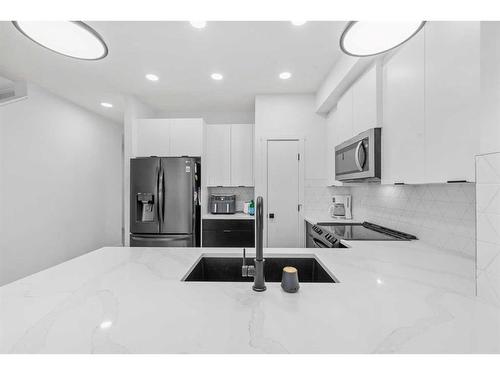 215 Creekstone Way Sw, Calgary, AB - Indoor Photo Showing Kitchen With Upgraded Kitchen