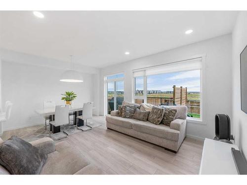 215 Creekstone Way Sw, Calgary, AB - Indoor Photo Showing Living Room