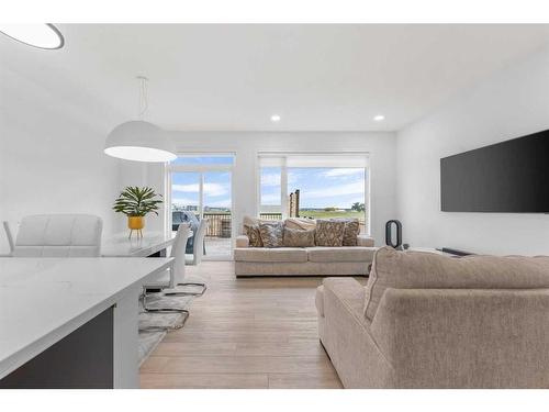 215 Creekstone Way Sw, Calgary, AB - Indoor Photo Showing Living Room