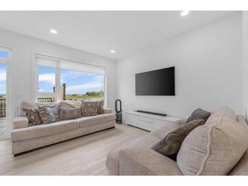 215 Creekstone Way Sw, Calgary, AB - Indoor Photo Showing Living Room