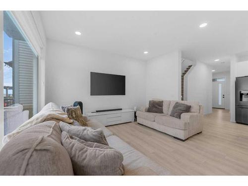 215 Creekstone Way Sw, Calgary, AB - Indoor Photo Showing Living Room