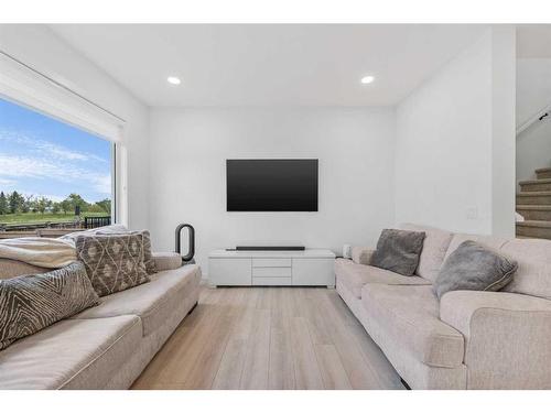 215 Creekstone Way Sw, Calgary, AB - Indoor Photo Showing Living Room