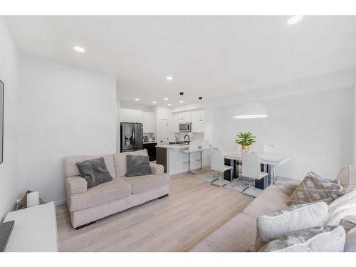 215 Creekstone Way Sw, Calgary, AB - Indoor Photo Showing Living Room