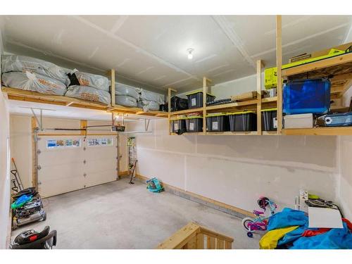 215 Creekstone Way Sw, Calgary, AB - Indoor Photo Showing Garage