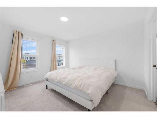 215 Creekstone Way Sw, Calgary, AB - Indoor Photo Showing Bedroom