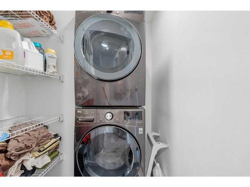 215 Creekstone Way Sw, Calgary, AB - Indoor Photo Showing Laundry Room