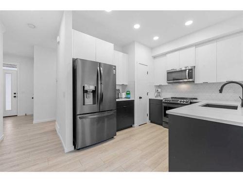 215 Creekstone Way Sw, Calgary, AB - Indoor Photo Showing Kitchen With Upgraded Kitchen