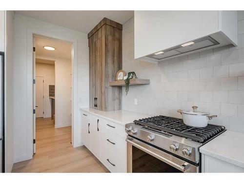 20 Monterra Landing, Rural Rocky View County, AB - Indoor Photo Showing Kitchen With Upgraded Kitchen