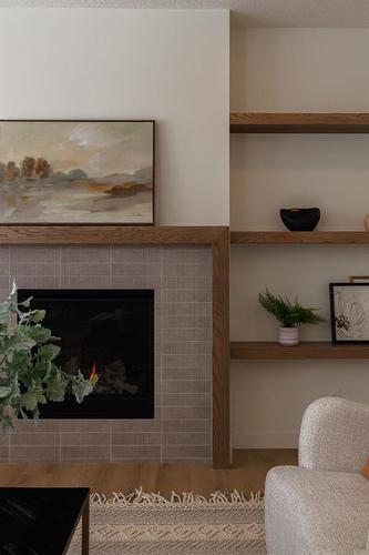 20 Monterra Landing, Rural Rocky View County, AB - Indoor Photo Showing Living Room With Fireplace