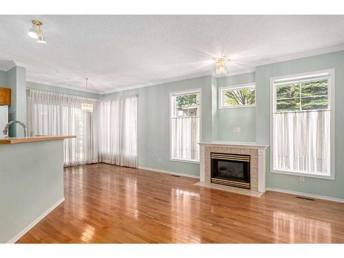 109 Edgeridge Terrace Nw, Calgary, AB - Indoor Photo Showing Living Room With Fireplace