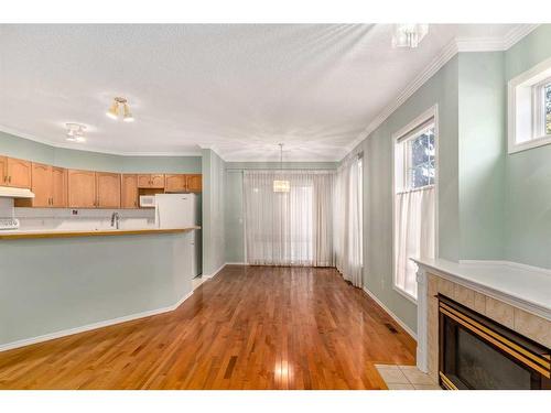 109 Edgeridge Terrace Nw, Calgary, AB - Indoor Photo Showing Kitchen With Fireplace