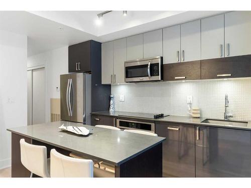 303-550 Riverfront Avenue Se, Calgary, AB - Indoor Photo Showing Kitchen With Upgraded Kitchen