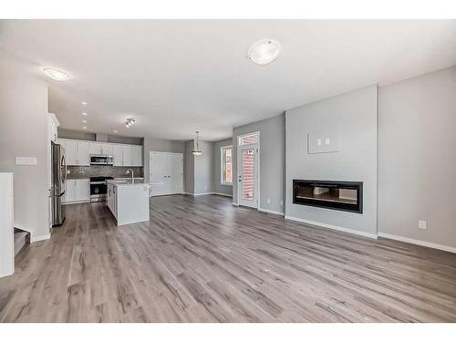 99 Carringford Close, Calgary, AB - Indoor With Fireplace