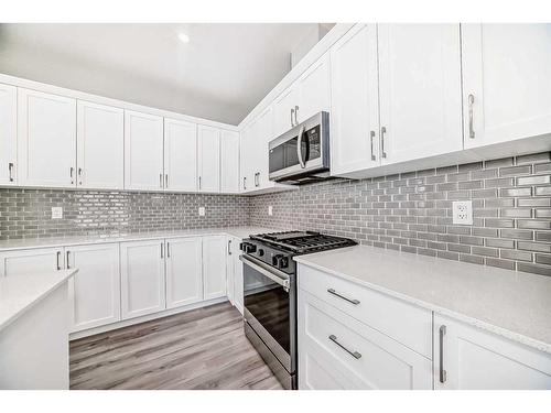 99 Carringford Close, Calgary, AB - Indoor Photo Showing Kitchen With Upgraded Kitchen