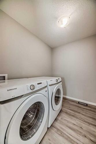 99 Carringford Close, Calgary, AB - Indoor Photo Showing Laundry Room